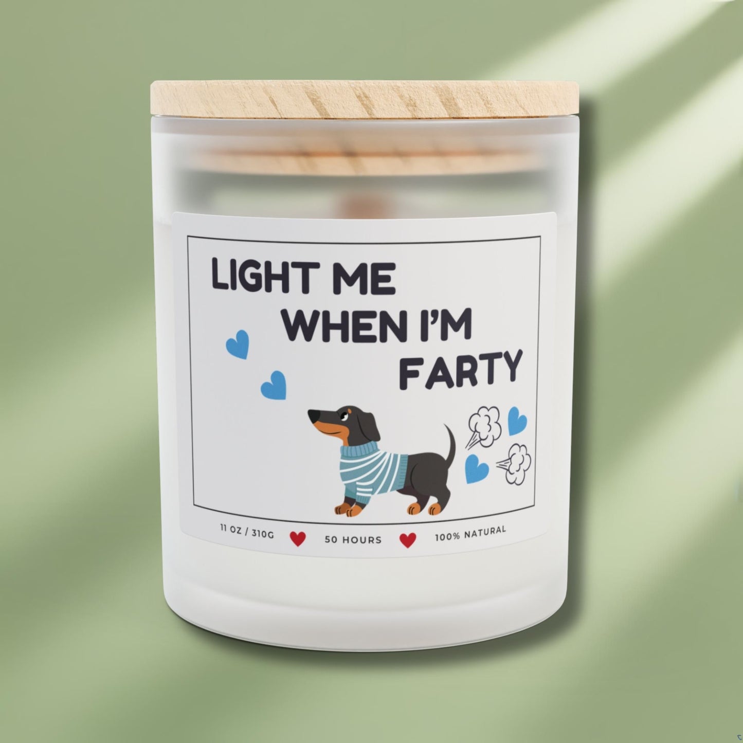 Front side of a candle for dog lovers with funny quote