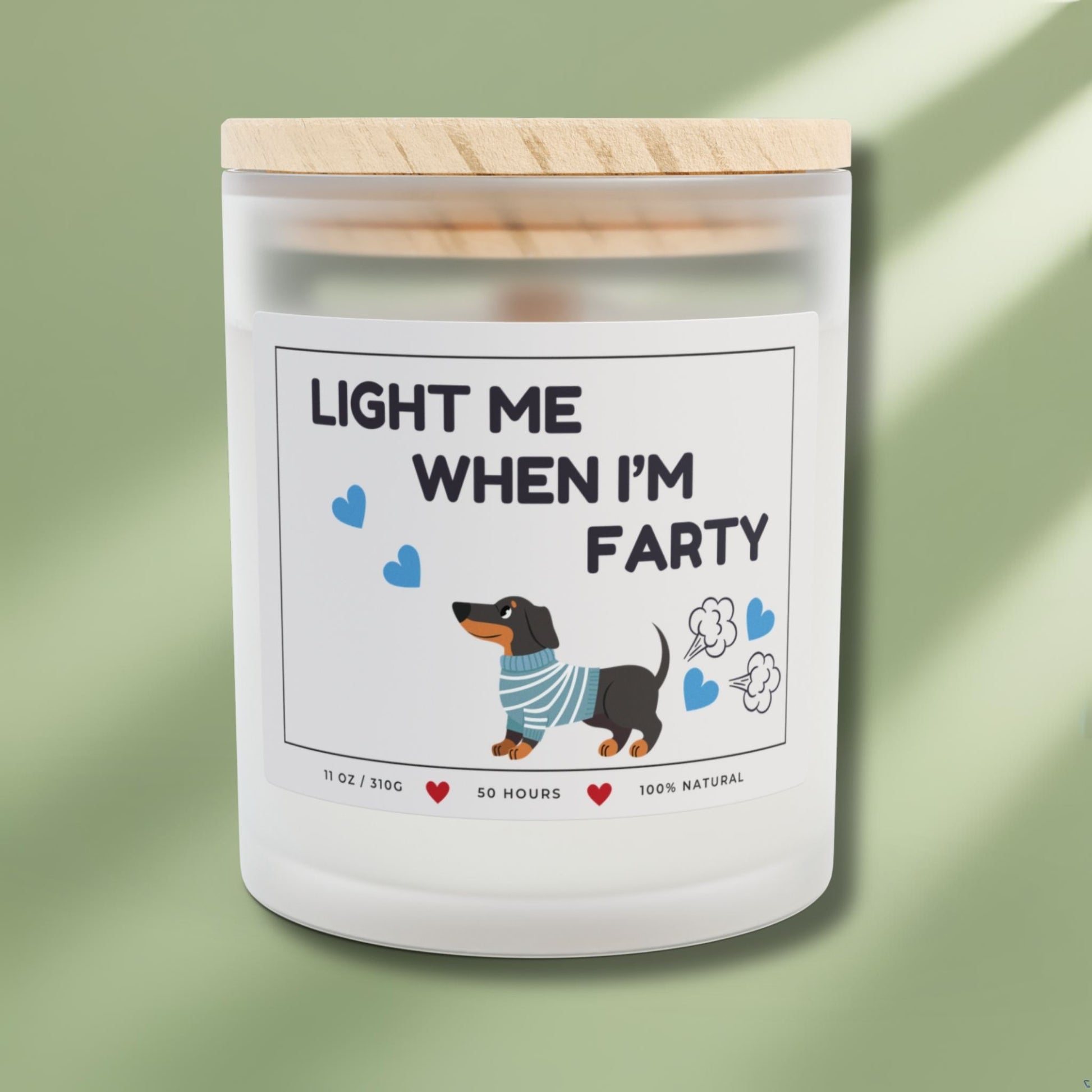 Front side of a candle for dog lovers with funny quote