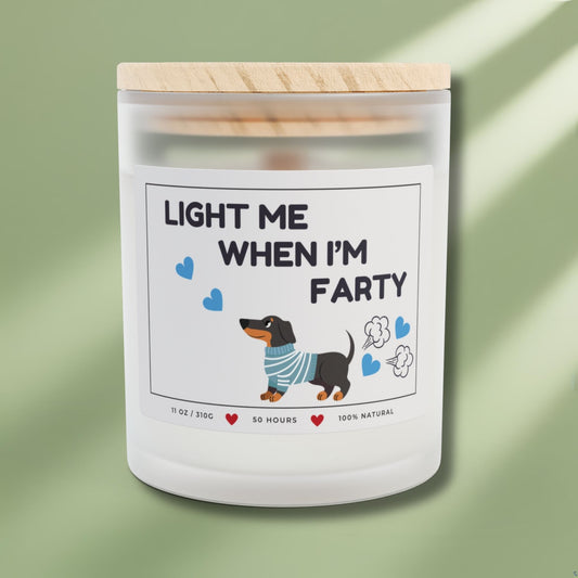 Front side of a candle for dog lovers with funny quote